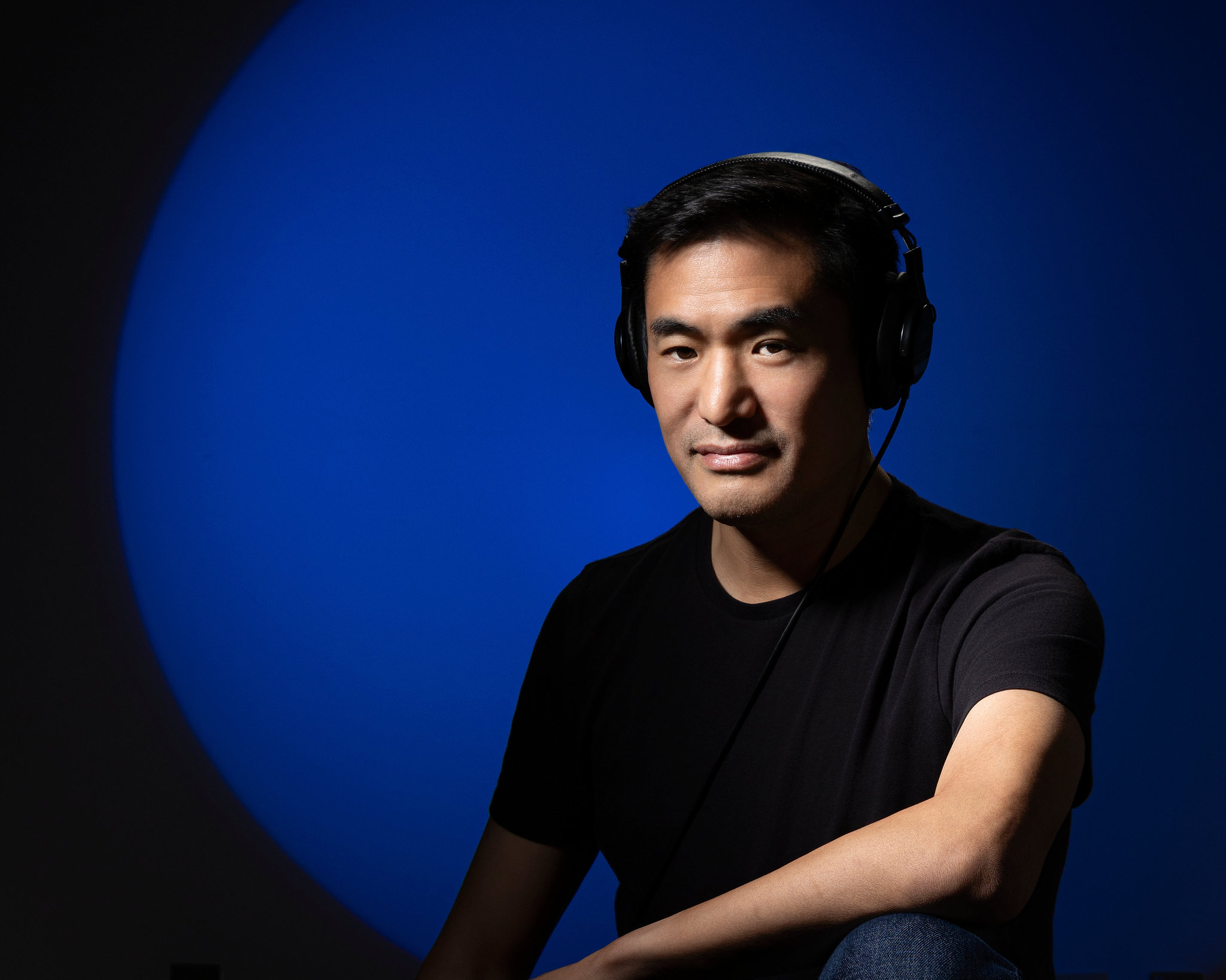 Jonathan Jun listening in the studio